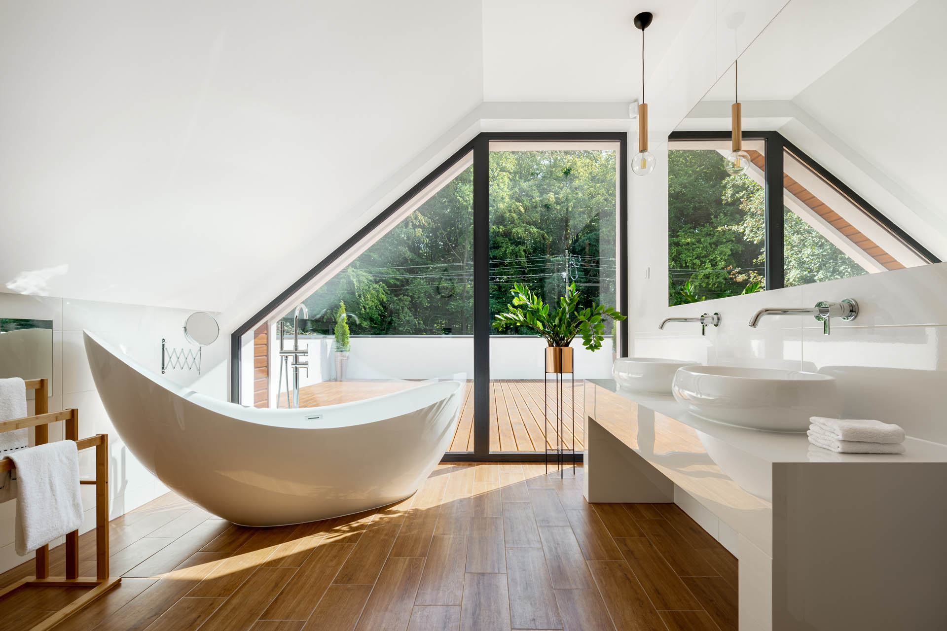 Elegant attic bathroom with bathtub